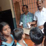 Helped People During Flood by providing biscuits DR.S.RAJENDRAN